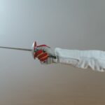 a fencer holding an epee